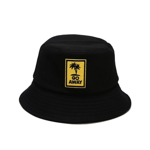Fashionable black cotton bucket hat featuring a yellow GO AWAY patch with palm tree design