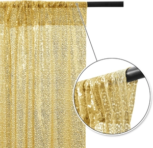 Detail showing the pole pocket design and golden sequin fabric texture of the tablecloth