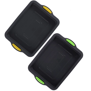Square non-stick brownie baking pan with colorful silicone handles on white background