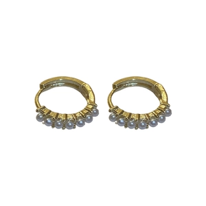 Minimalist gold-tone hoop earrings featuring delicate pearl embellishments and clasp design