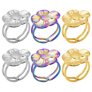 Detailed view of flower rings in gold, silver and rainbow finishes with adjustable bands