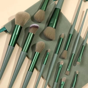 13-piece professional makeup brush set with green gradient handles and storage pouch