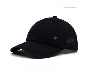 Detail of Freestyle 3D embroidery and metal plate on navy blue cotton baseball cap