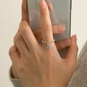 Minimalist 925 sterling silver beaded chain ring featuring a round metal charm pendant