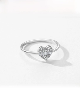 Macro shot of S925 silver heart ring with pavé round and baguette-cut zircons