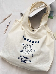 Cute canvas tote bag with rabbit astronaut print, large capacity for students and daily use