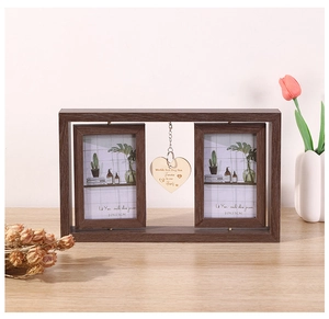 Detail of rotating wooden frame with a hanging wooden heart and pet memorial engraving