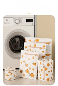 Mesh laundry bag set for delicate washing featuring orange prints and fine mesh texture