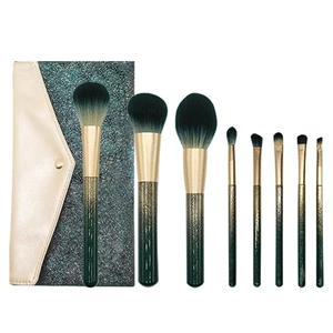 Set of 8 green glitter makeup brushes with soft bristles and matching cosmetic storage bag