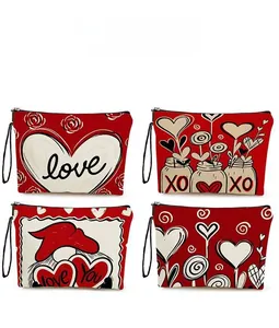 Detail view of four heart-themed makeup bags with Love patterns and black zippers
