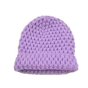Detail of light purple chunky knit beanie with textured stitch and folded brim detail