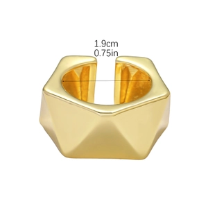 Macro detail of gold geometric ring with 1.9cm inner diameter and faceted design