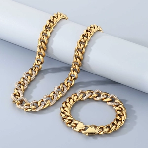 Close-up of 13mm gold plated Cuban link chain necklace and bracelet with pave diamond inlay