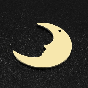 Detailed view of gold stainless steel crescent moon face charm with polished finish