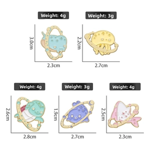 Detailed view of sea creature enamel pins with sizes and weight specifications