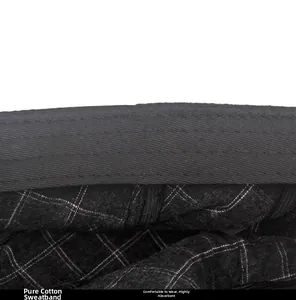 Detail view of cotton sweatband with white mesh stitching inside the leather newsboy cap