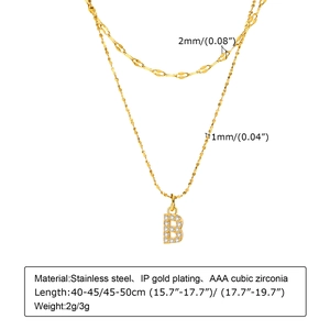 Detail showing dimensions of a double-layered gold stainless steel initial necklace