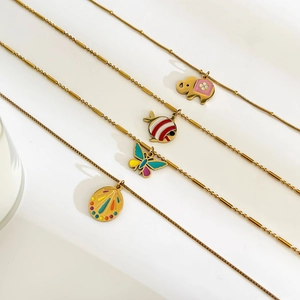 Chic gold stainless steel necklaces featuring colorful enamel animal and shell pendants