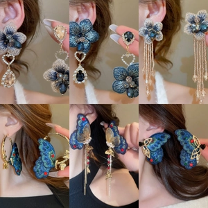 Vintage floral embroidery earrings with glass tassels and butterfly charms on models