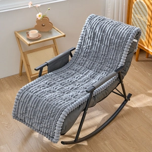 Close-up detail of thickened grey plush flannel cushion texture on a black rocking chair