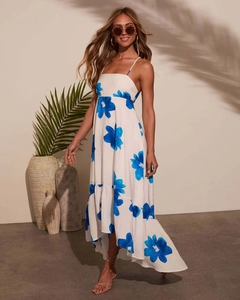 Detail of bohemian summer dress showing blue floral print and high-low hemline