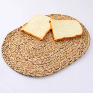 Handwoven water hyacinth oval placemat for heat insulation and dining table decoration