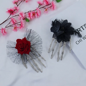 Gothic Halloween hair clips featuring skull hands with red roses and dark lace details