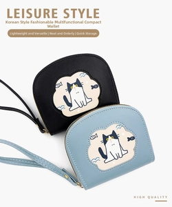 Close-up of small zipper wallet with cute cartoon cat pattern and wrist strap
