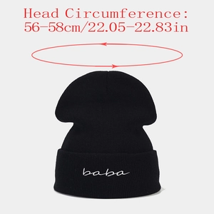 Close-up of black knit beanie featuring white baba embroidery and 56-58cm size detail