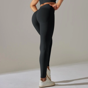 Detail of high-waisted seamless yoga leggings with vertical texture and contouring fit