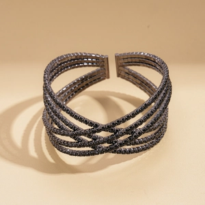 Detail of multi-layered black crystal cuff bracelet with high-end dark metal finish
