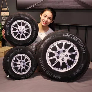 3D car tire plush pillows in three sizes featuring realistic silver rim and velvet texture