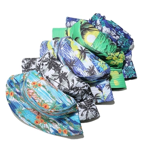 Tropical island print bucket hats with coconut trees and hibiscus flowers for sun protection