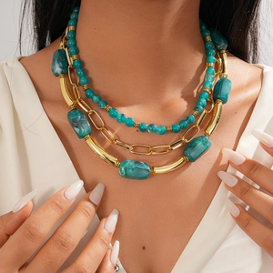 Bohemian multilayer sweater necklace with golden chains and blue-green acrylic beads