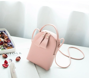 Pink mini PU leather crossbody bag with dual zipper detail and slender shoulder strap