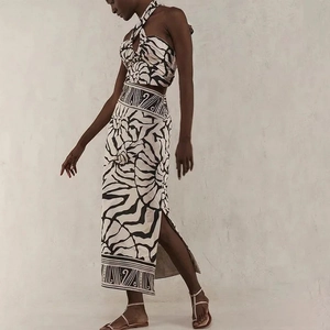 Halter top and high-waisted slit maxi skirt set with black tribal geometric print