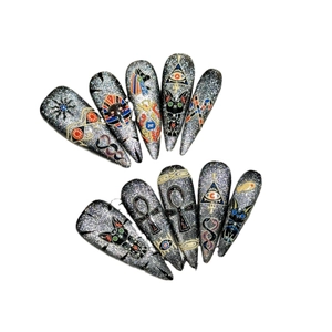 Ancient Egyptian theme press-on nails with silver glitter and pharaoh cat patterns