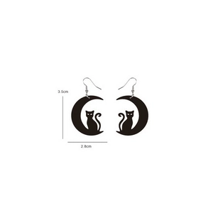 Detail view of black acrylic cat and moon earrings with dimensions 3.5cm by 2.8cm