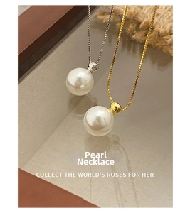 Detailed close-up of S925 silver and gold pearl necklaces reflected on a mirror surface