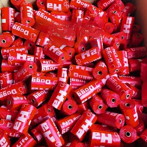 Bulk red rolls of biodegradable dog waste bags with white printed logo in a box