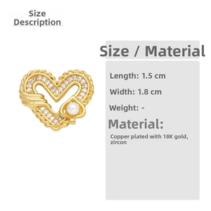 Detail of heart-shaped earring with pearls and zircons in 18K gold plated copper