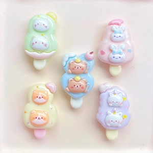 Flat lay of colorful resin ice cream charms with cute cat bear and rabbit designs