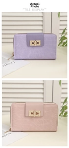Detail of crocodile pattern faux leather wallets with golden twist lock and zip closure