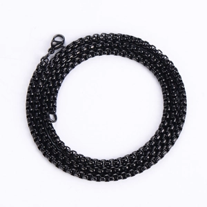 Detail of a black vacuum-plated stainless steel box chain with a secure lobster clasp