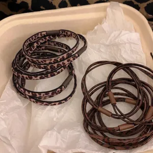 Elastic leopard print hair ties set in a minimalist beige gift box with matte connectors