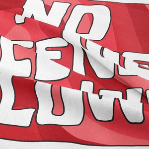 Detail view of red fabric with high-quality white No Fear lettering and soft texture