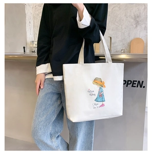 Detail of white canvas tote bag with Nice Day cartoon illustration and cat print