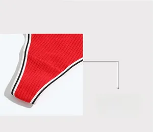 Detail of red ribbed thong with black and white striped trim for skin-friendly comfort