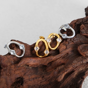 Irregular round earrings with rhombus zircon in gold and silver finish on wood