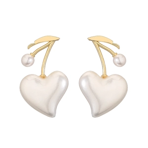 Close-up of elegant cherry-shaped copper earrings with gold leaves and white pearl hearts